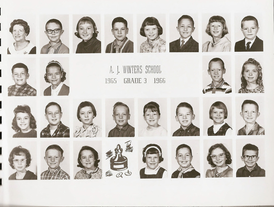A grid of individual portraits featuring young students and one adult, likely a teacher, arranged in rows. The text in the center reads "A. J. Winters School 1965 Grade 3 1966." The portraits consist of children with various hairstyles and attire. At the bottom, there is an illustration of an ink bottle and pen nib.
