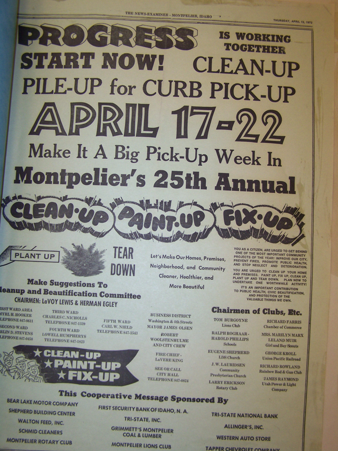 A document from "The News-Examiner" in Montpelier, Idaho, dated Thursday, April 13, 1972, announces a clean-up event. The large text reads, "PROGRESS IS WORKING TOGETHER START NOW! CLEAN-UP PILE-UP for CURB PICK-UP APRIL 17-22 Make It A Big Pick-Up Week In Montpelier's 25th Annual CLEAN-UP PAINT-UP FIX-UP." It includes various details such as chairmen names, phone numbers, and a list of participating businesses and organizations. There are decorative elements like a bush labeled "PLANT UP" and the words "TEAR DOWN."