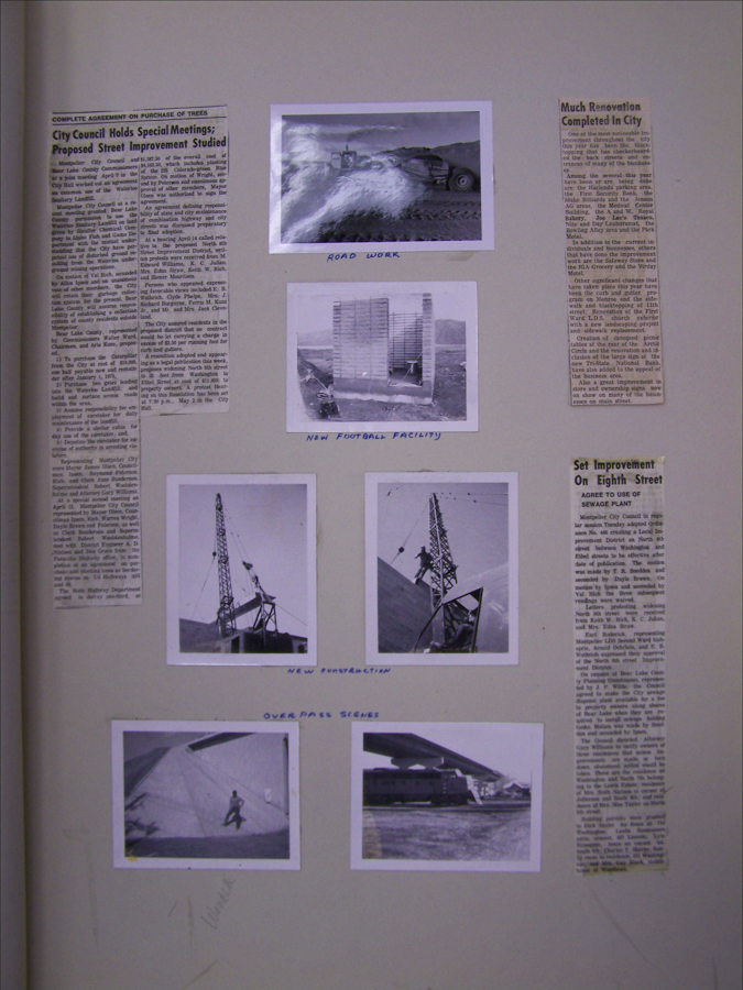 A collection of clippings and photographs mounted on a page. 

On the left, a newspaper article titled "City Council Holds Special Meetings; Proposed Street Improvement Studied." 

Near the top center, a photograph labeled "Road Work" shows construction equipment working on a dirt road.

Below, a photograph labeled "New Football Facility" depicts a building under construction with visible scaffolding.

Two photographs labeled "New Construction" show workers on cranes and steel structures.

At the bottom, images labeled "Over Pass Scenes" show a worker on a sloped surface and a structure resembling an overpass.

On the right, two separate newspaper articles, one titled "Much Renovation Completed in City" and the other "Sewage Plant Improvement On Eighth Street," discuss local infrastructure projects.