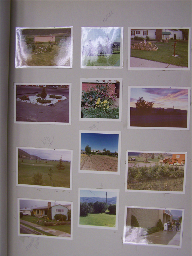 A collection of twelve images mounted on a gray surface. The images depict various scenes including buildings, gardens, landscapes, and a street view. Some handwritten notes are visible near the images, with words such as "wide," "big corner," and "Miners' addition."