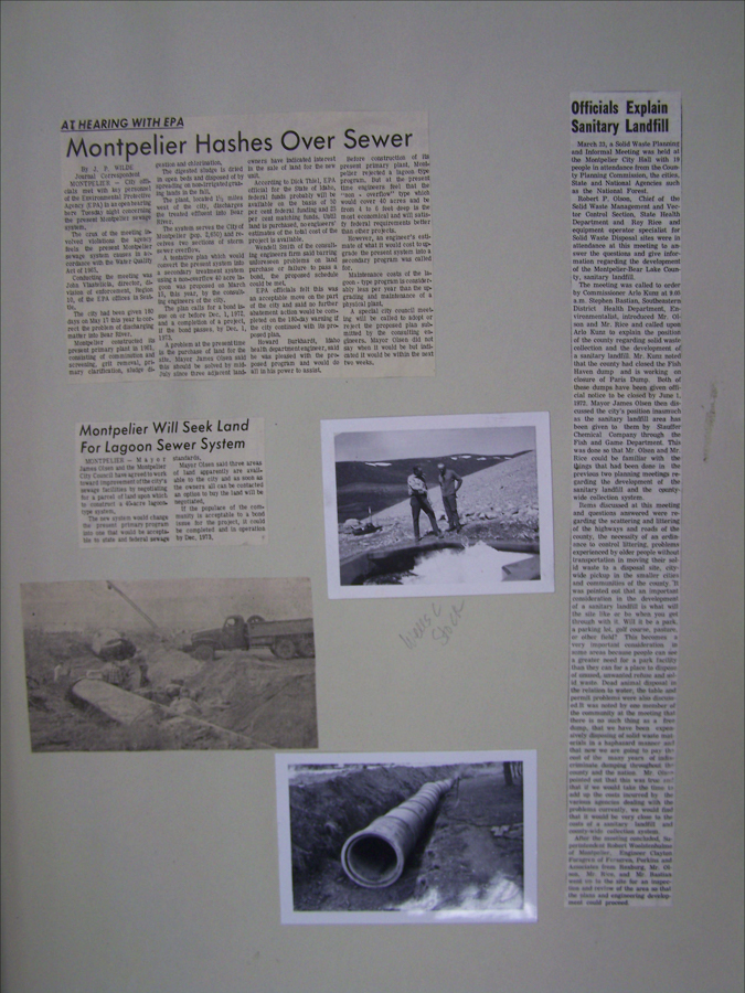 Three newspaper articles are presented alongside black and white photographs. The main headline reads "Montpelier Hashes Over Sewer" and discusses sewer system issues. Another article titled "Montpelier Will Seek Land For Lagoon Sewer System" is located below. A third article titled "Officials Explain Sanitary Landfill" appears on the right. The photographs depict workers with pipes in a barren landscape and a pipeline trench. Handwritten text beneath the top right photo reads "News E Scrap."
