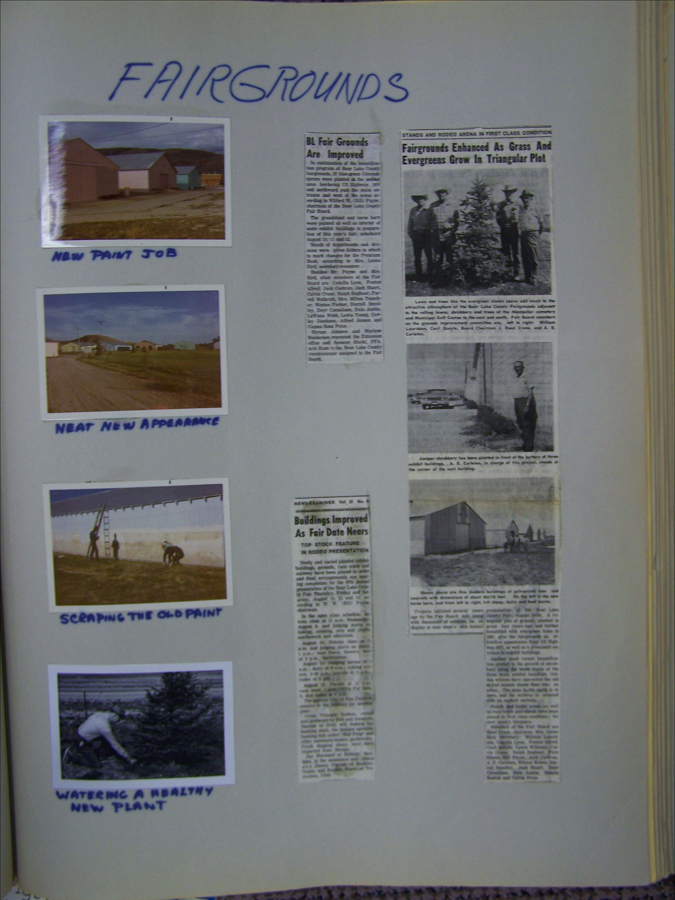 A scrapbook page titled "FAIRGROUNDS" features several photographs and newspaper clippings. The top left shows buildings with a "NEW PAINT JOB," and below it, a scene labeled "NEAT NEW APPEARANCE." Another photo shows people "SCRAPING THE OLD PAINT," and a fourth image depicts someone "WATERING A HEALTHY NEW PLANT." The page includes newspaper articles with headlines such as "BL Fair Grounds Are Improved," "Fairgrounds Enhanced As Grass And Evergreens Grow In Triangular Plot," and "Buildings Improved As Fair Date Nears."