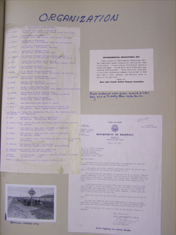 "Organization" is written at the top of the page. Below, there is a typed list of locations and names of individuals next to them. A notice titled "Environmental Educational Day" describes a cleanup event organized by the Bear Lake County School Cleanup Committee, noting that motorists receive a card, a litter bag, and a friendly Bear Lake smile. A letter from the Idaho Department of Highways, dated April 13, 1971, addresses support for a roadside litter project by Bear Lake Schools. At the bottom left, there is an image labeled "Getting Underway," showing people working near a road sign.