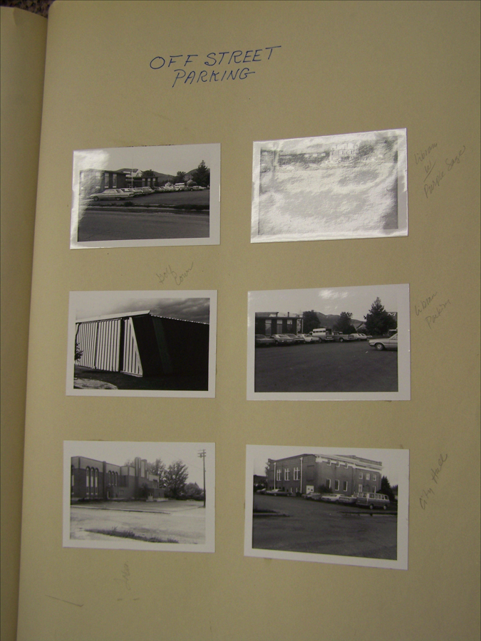 A page with six photographs of different parking areas and buildings. The top of the page is labeled "OFF STREET PARKING." Handwritten notes next to the images identify locations such as "Libr[ary] Photo Sculps," "Safeway [Door]," "Libr[ary] Parking," and "City Hall."