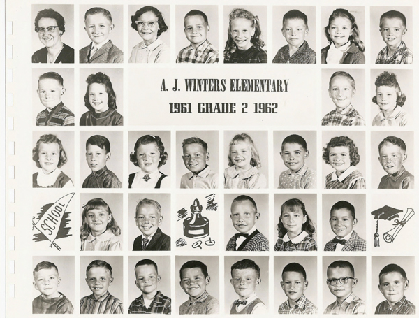Grid of individual portraits featuring young children and one adult, likely a teacher, arranged in five rows. The third row has a label in the middle: "A. J. Winters Elementary 1961 Grade 2 1962." There are illustrated graphics of a school pennant, a school bell, and a graduation cap with a diploma on the bottom and second rows. Each child is dressed in early 1960s-style clothing.