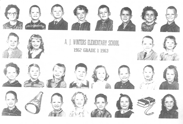 Rows of individual portraits of children and one adult, likely a group from a school. In the center, text reads "A. J. Winters Elementary School 1962 Grade 1 1963." At the bottom are illustrations of a megaphone and a stack of books with an apple.