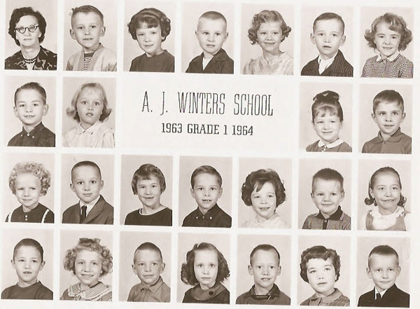 Portraits of children and one adult arranged in a grid pattern. At the center, text reads "A. J. Winters School, 1963 Grade 1 1964." There are five rows of images, featuring individual headshots of each child. The adult, possibly a teacher, is located in the top left corner.