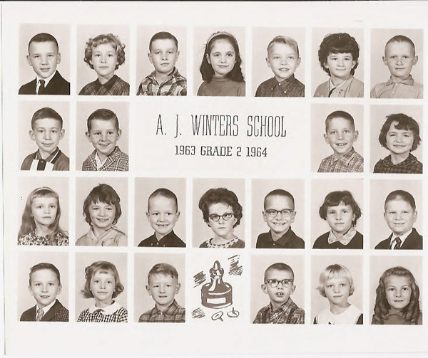 A grid of school portraits featuring 24 children. At the center is the text "A. J. Winters School, 1963 Grade 2 1964." Each child is shown from the shoulders up, with a variety of expressions and hairstyles. At the bottom, there is an illustration of a student ringing a bell.