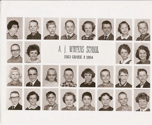 A grid of individual headshots, including a teacher and students, with the text "A. J. Winters School, 1963 Grade 3 1964" in the center. The top row features an adult and young boys, while the remaining rows show young boys and girls, all in formal attire.