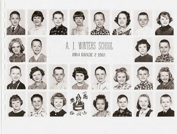 A grid of individual portraits of young children arranged in rows. Each child is smiling and dressed in different clothing styles. In the center is the text "A. J. WINTERS SCHOOL 1964 GRADE 2 1965." Below the text is a graphic of a teacher at a desk with a pencil and apple.