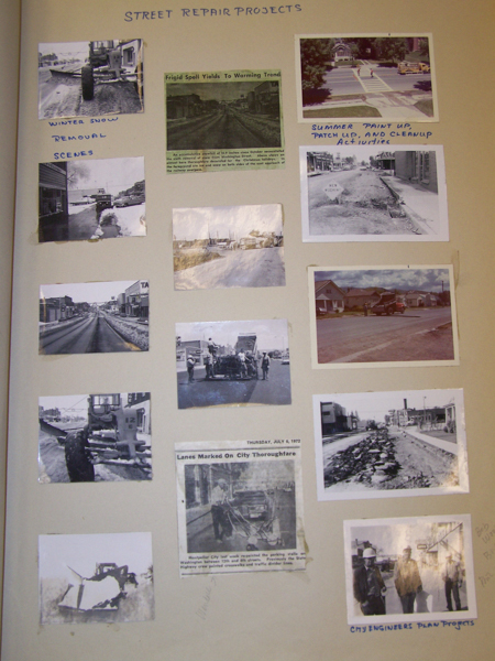 A collection of photographs and newspaper clippings labeled "Street Repair Projects." The images depict various scenes related to street maintenance and construction. There are images of winter snow removal, street repair activities, and city engineers. Some images show vehicles and workers engaged in roadwork. Handwritten notes accompany the images, including phrases like "Winter Snow Removal Scenes" and "Summer Paint Up, Patch Up, and Cleanup Activities." The newspaper clippings contain headlines such as "Frigid Spell Yields To Warming Trend" and "Lanes Marked On City Thoroughfare" dated July 6, 1972.