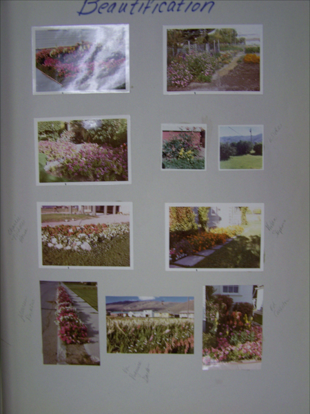 The image displays a collection of nine photographs showcasing various gardens and flower beds. These include neatly arranged flowerbeds alongside walkways and gardens filled with blooming flowers. Handwritten annotations around some of the photos mention locations or names such as "White", "Crissie Steele House", "Vera Francis House", and "Rose Garden". The word "Beautification" is written at the top.