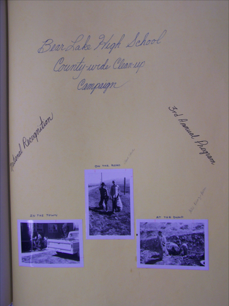 Bear Lake High School County-wide Clean-up Campaign is written at the top. The page includes three smaller images labeled "In the Town," "On the Road," and "At the Dump." "National Recognition" is written on the left, and "3rd Annual Program" on the right. Handwritten notes are visible near the images.