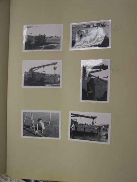 A series of six images depicting construction scenes involving utility trucks and equipment. One image shows a person digging with a shovel. Two images focus on trucks labeled "City of Loveland" with cranes or digging apparatus. A person is kneeling by a ladder in another image. Handwritten notes on two images read "Road Dividers" and "Willie Shot."
