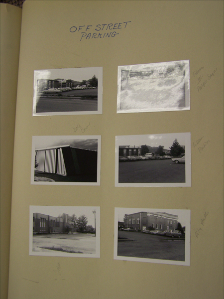 A page with six photographs of different parking areas and buildings. The top of the page is labeled "OFF STREET PARKING." Handwritten notes next to the images identify locations such as "Libr[ary] Photo Sculps," "Safeway [Door]," "Libr[ary] Parking," and "City Hall."
