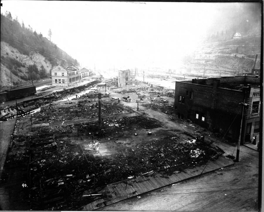Image of Wallace, Idaho after the fire of August 20, 1910. Caption ""General view from Samuel's Hotel, showing Oregon, Washington Railroad and Navigation station, August 20, 1910""