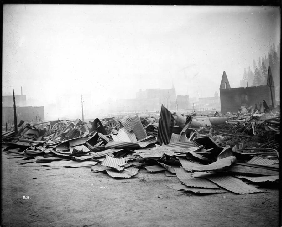 Image shows the debris from the Coeur d'Alene Hardware Warehouse on September 3, 1910 after  the fire on August 20, 1910 swept went through Wallace, Idaho.