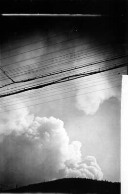 Plumes of smoke appear over Wallace before August 20 forest fire enters town