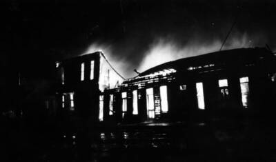 Night time image of the forest fire burning buildings in Wallace, Idaho August 20, 1910.