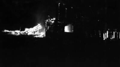 Night time image of the forest fire burning buildings in Wallace, Idaho August 20, 1910.