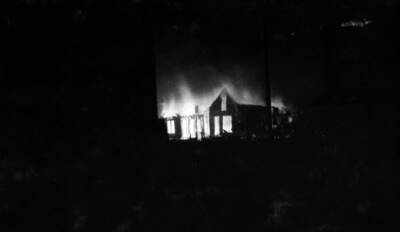 Night time image of the forest fire burning buildings in Wallace, Idaho August 20, 1910.
