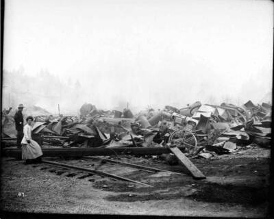 Image shows the debris from the Coeur d'Alene Hardware Warehouse on September 3, 1910 after  the fire on August 20, 1910 swept went through Wallace, Idaho.