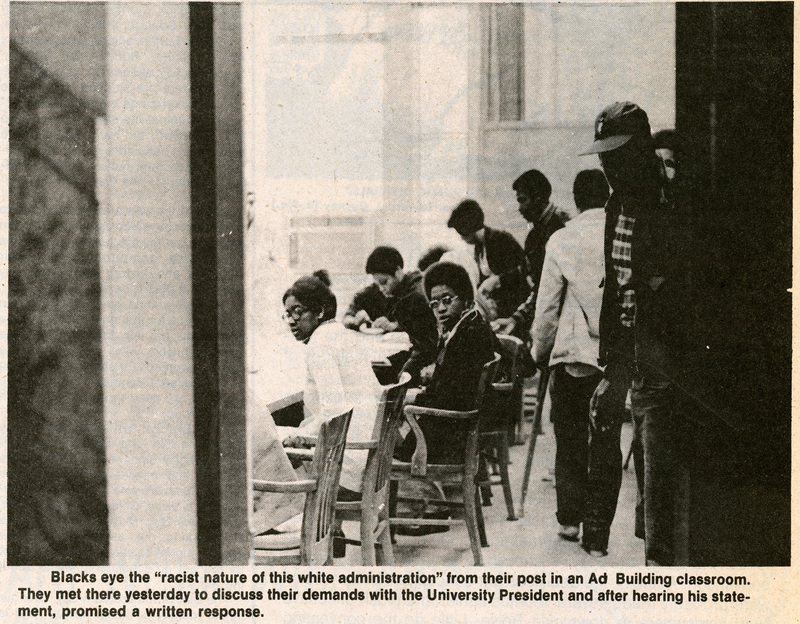Image and caption from the Argnonaut. Image depicts students meeting to discuss their demands with the University President.