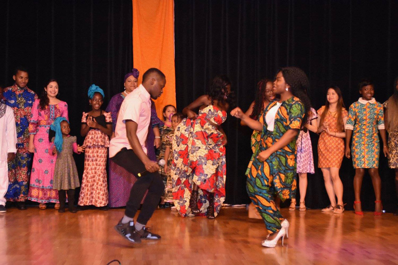 Fashion show participants dance after the show at the 2017 Africa Night.