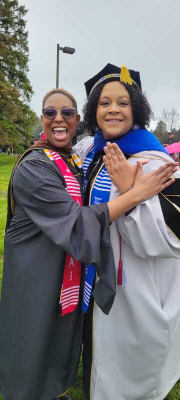 Dr. Samuels graduating with a PhD and KT Turner graduating with a Masters.