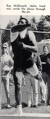 Caption from the Gem reads, "Ray McDonald, Idaho track star, sends the discus through the air."