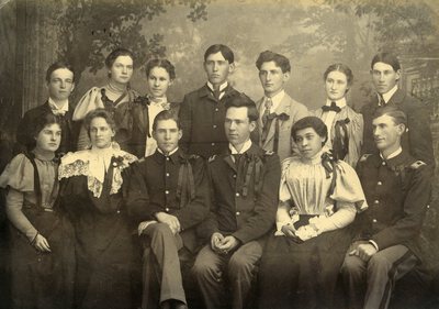 Back row (left to right): Fred Merriam, Clara Playfair, Eva Nichols, Clem Herbert, Guy Wolfe, Ava Sweet, Fred Moore. Front row (left to right): Kate Hanley, Maude Mix, Charles Armstrong, Will Stillinger, Jennie Eva Hughes, Gilbert Hogue.