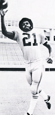 Collie Mack throwing a football.