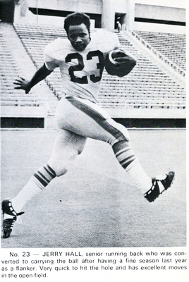 Jerry Hall running with a football.