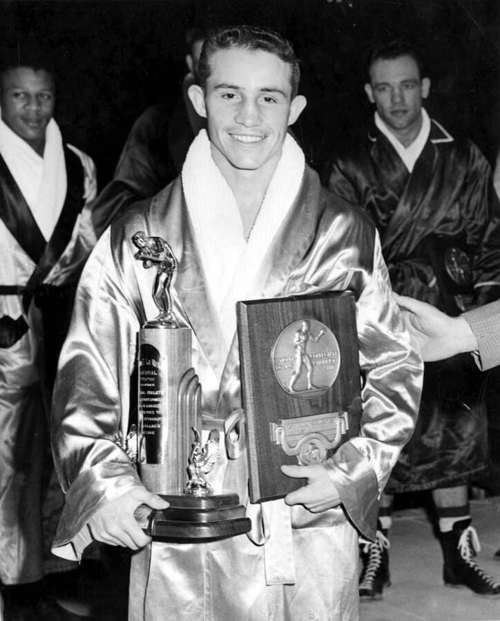 Frank Echevarria, University of Idaho boxer, with trophies - 1952 NCAA Champion; 119 lbs.