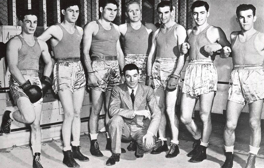 University of Idaho boxing squad - Kneeling: Coach Louie August.  Standing: Ted Kara, Bud Benoit, Alex Passic, Co-captains Carl Killian and Joe Fallini, Sam Zingale, Hank Struab. 