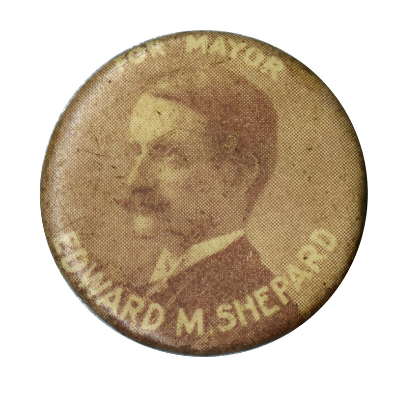 Round button with a portrait of Edward M. Shepard and white text reading: "For mayor Edward M. Shepard".