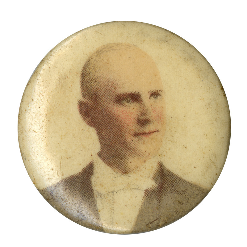 Round, white button with a portrait of Eugene Debs. 
