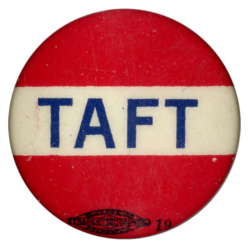 Round, red button with white rectangle across the center and blue text reading "Taft".