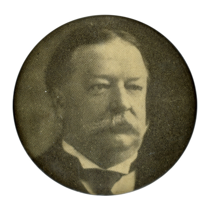 Round, gray button with a black and white portrait of William Howard Taft. 