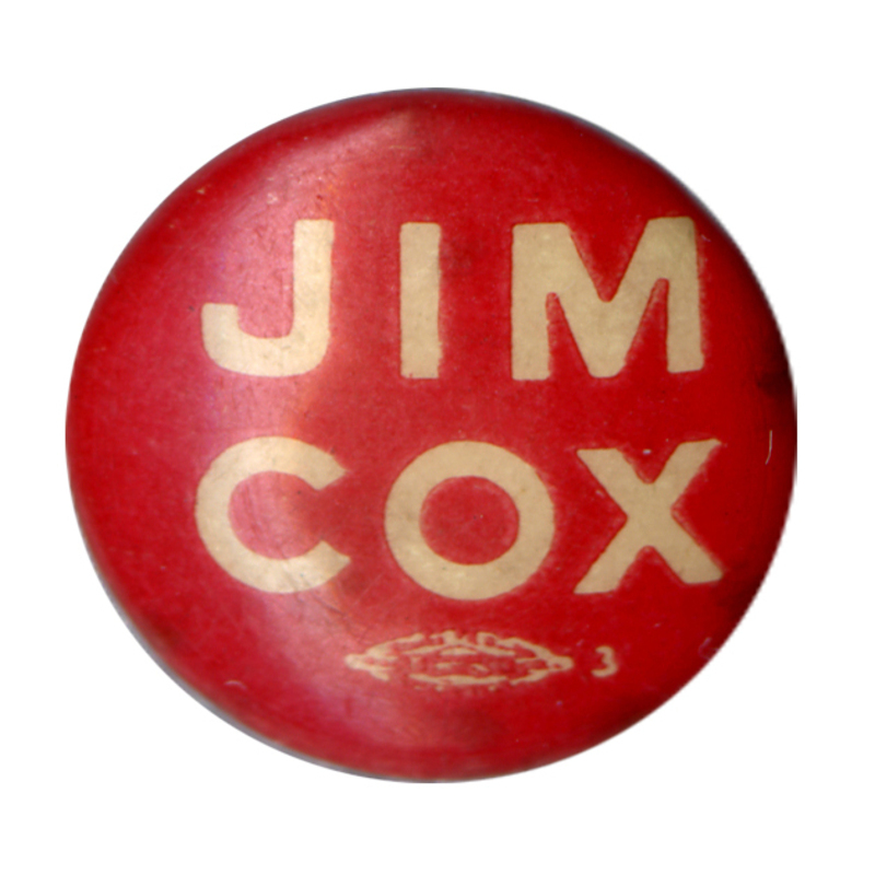 Round, red button with white bold text reading "Jim Cox".