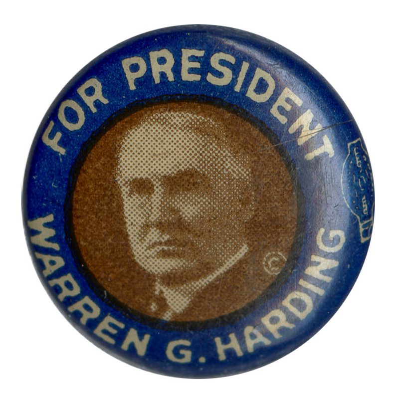 Round button with a blue border, and black and white portrait of Warren G. Harding. White text reads "For President Warren G. Harding."