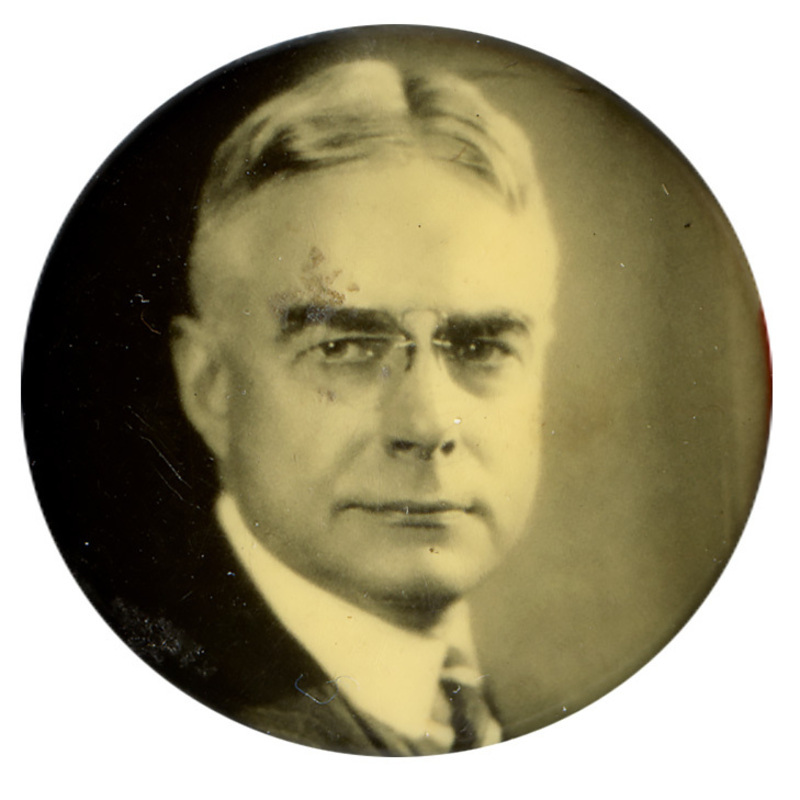 Round button with a black and white portrait of Albert C. Ritchie.