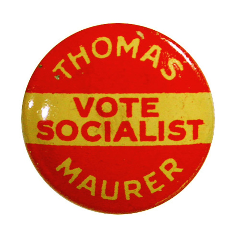 Round, red button with white and red font "Thomas Maurer Vote Socialist".