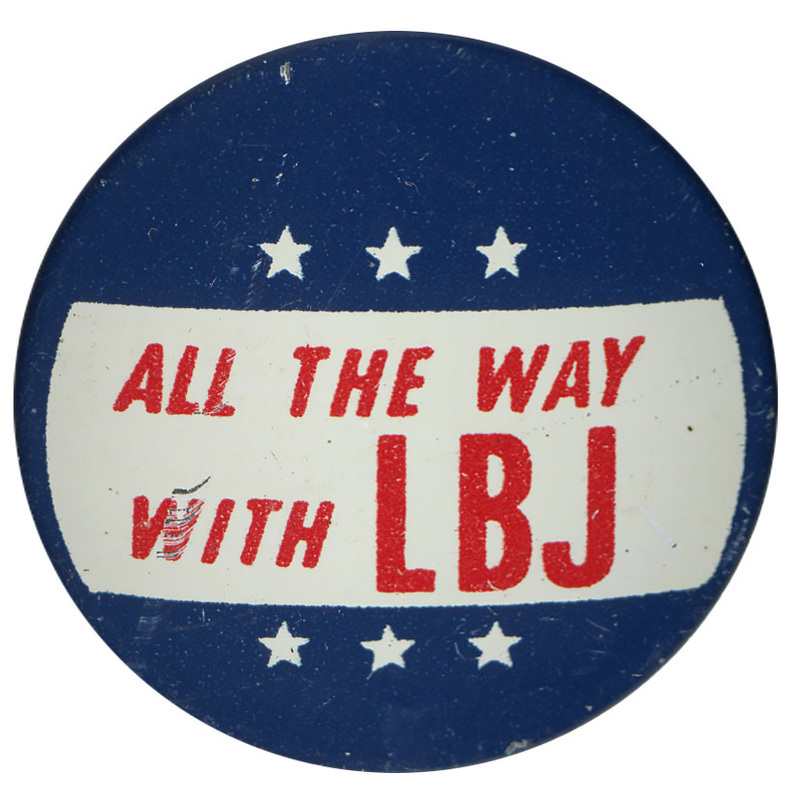 Round, blue button with white stars and red text reading "All the Way with LBJ"