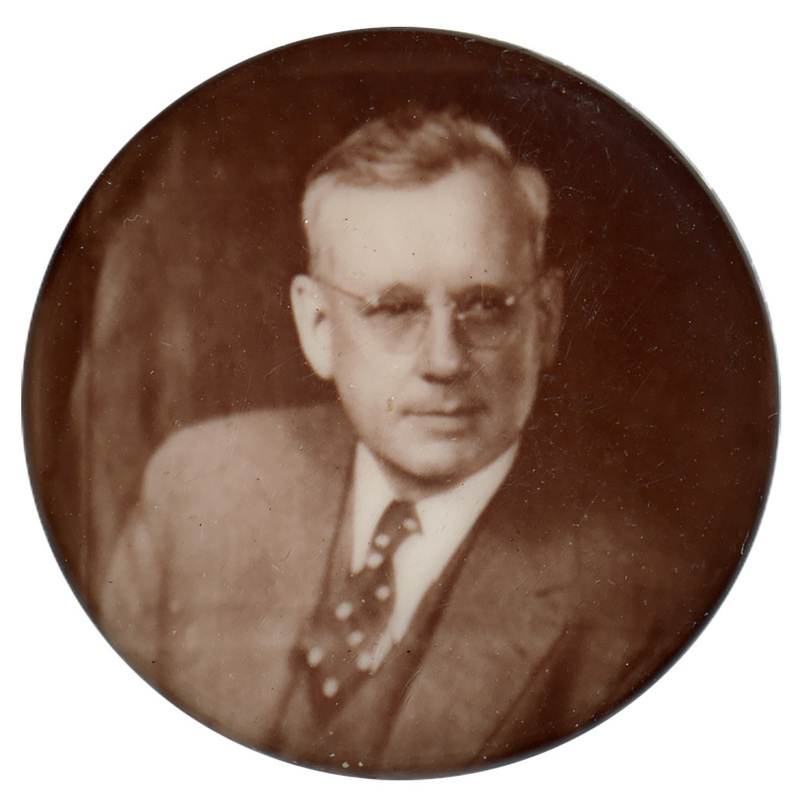 Round button with a sepia-toned portrait of Alfred Landon.