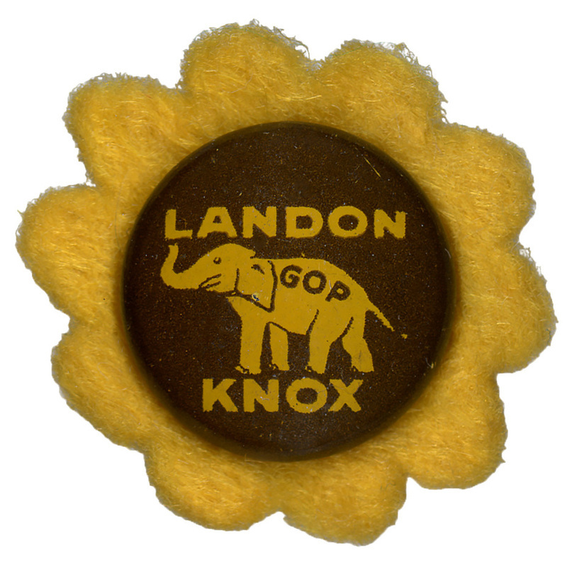A round button with a yellow elephant with the letters "GOP" on the elephant's side. Yellow text reads "Landon Knox" on a brown background and sits atop a yellow flower-shaped felt piece.