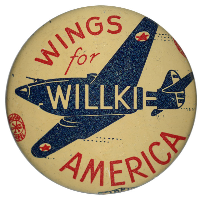 Round, white button with the silhouette of a plane with white text reading "Willkie" across the side of the plane. Red text reads "Wings for America" encircles the plane.