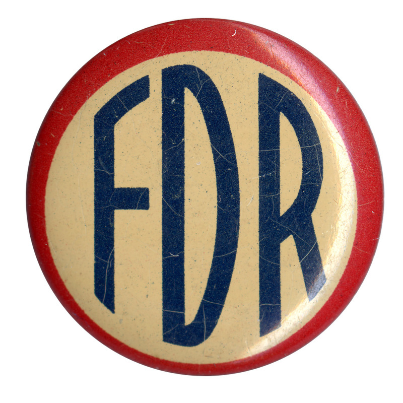 Round, off-white button with red border. Large blue text reads "FDR".
