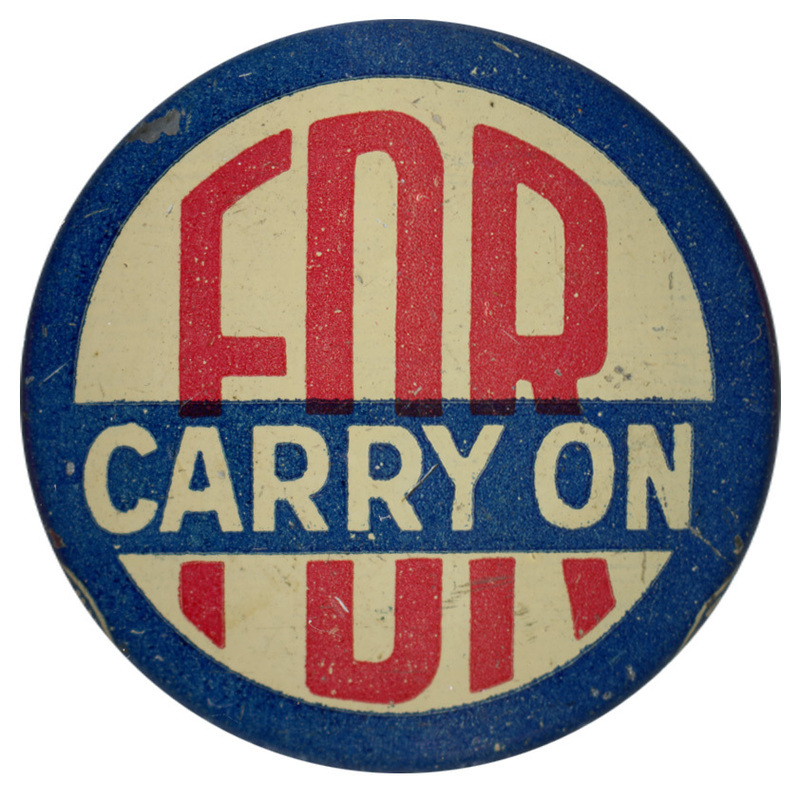 Round, off-white button with blue border. Large red text reads "FDR Carry on". 