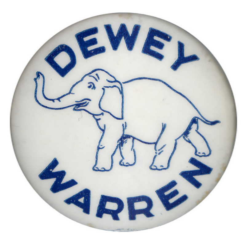 Round, white button with a graphic of an elephant at the center. Blue text encircling the elephant reads "Dewey Warren". 